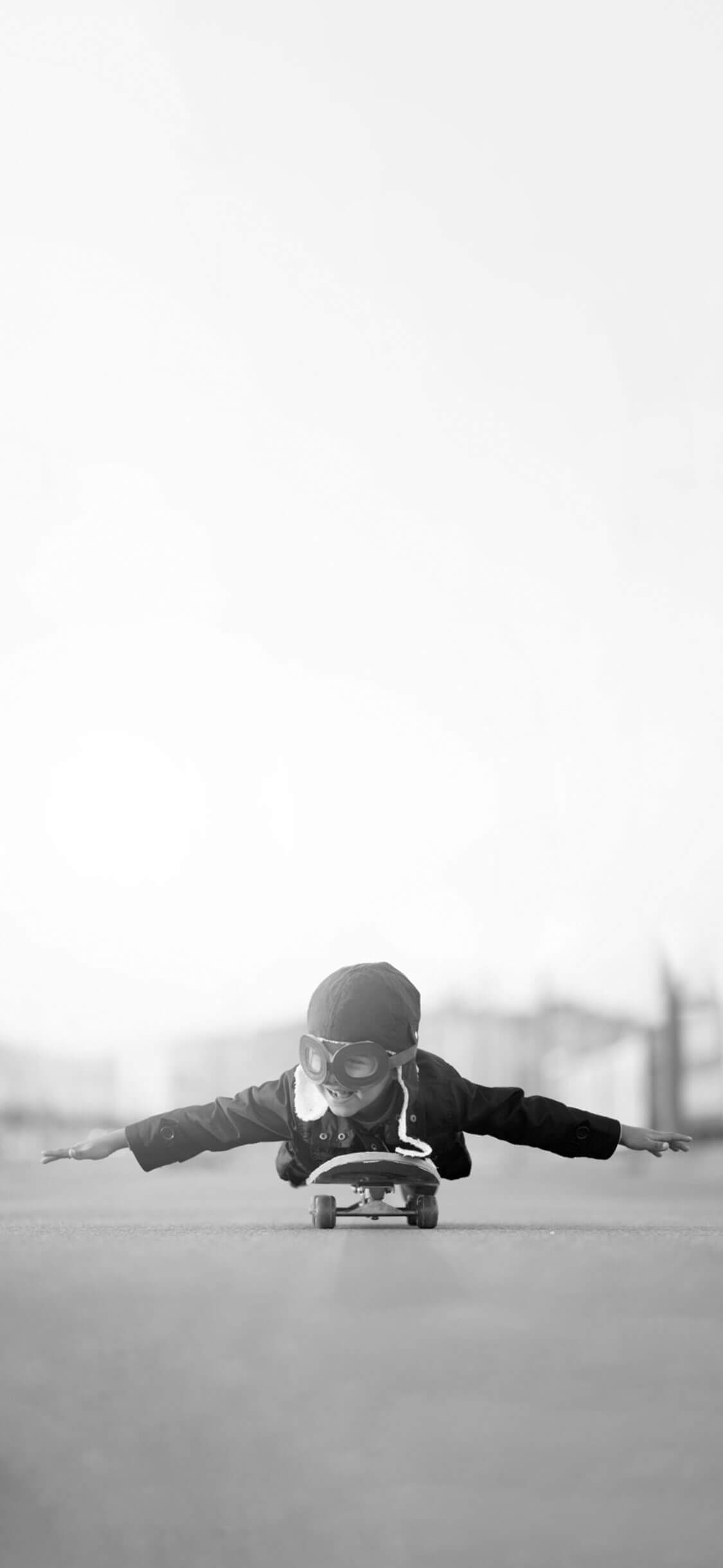 Little Boy On Skateboard